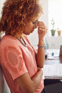 Cropped shot of a businesswoman looking stressed out at work